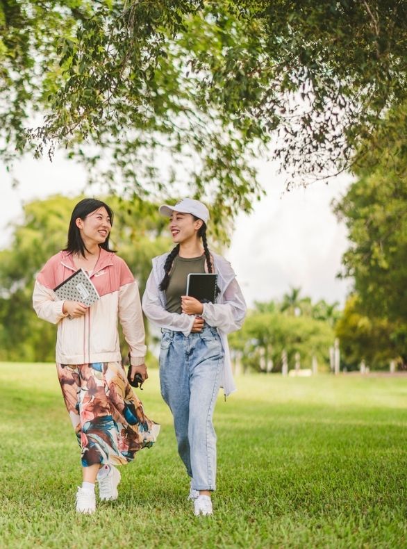 two students walk through FIU campus in Miami